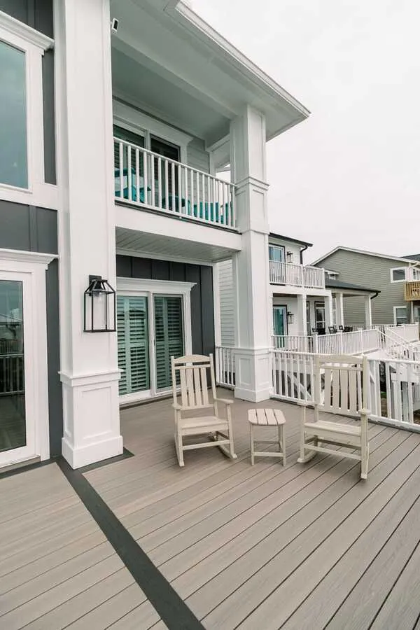 Composite deck with white rail and rocking chairs