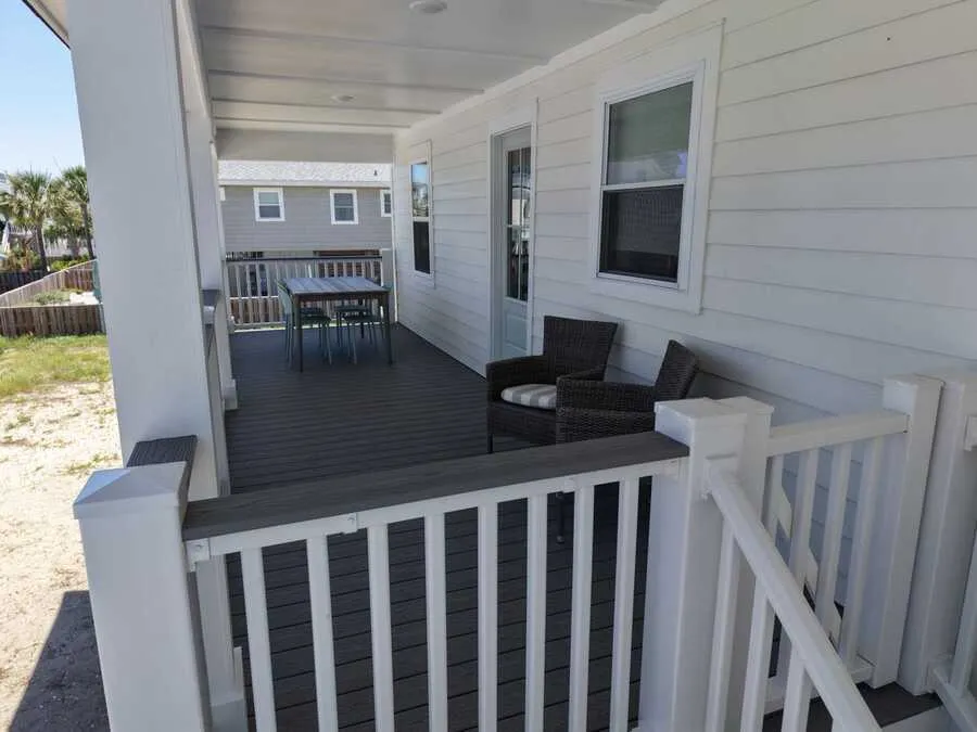 Covered porch with white rail