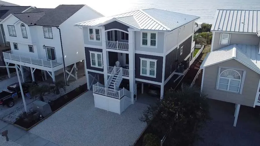 Aerial view of raised homes in a Brunswick County beach town