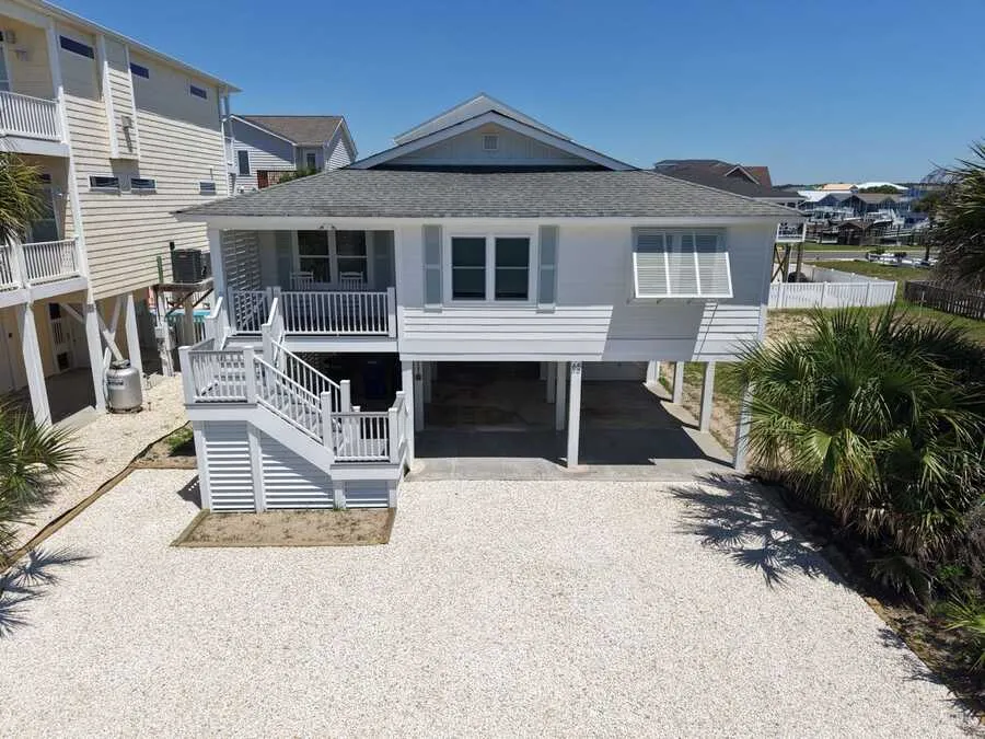 Raised white beach cottage with new exterior package