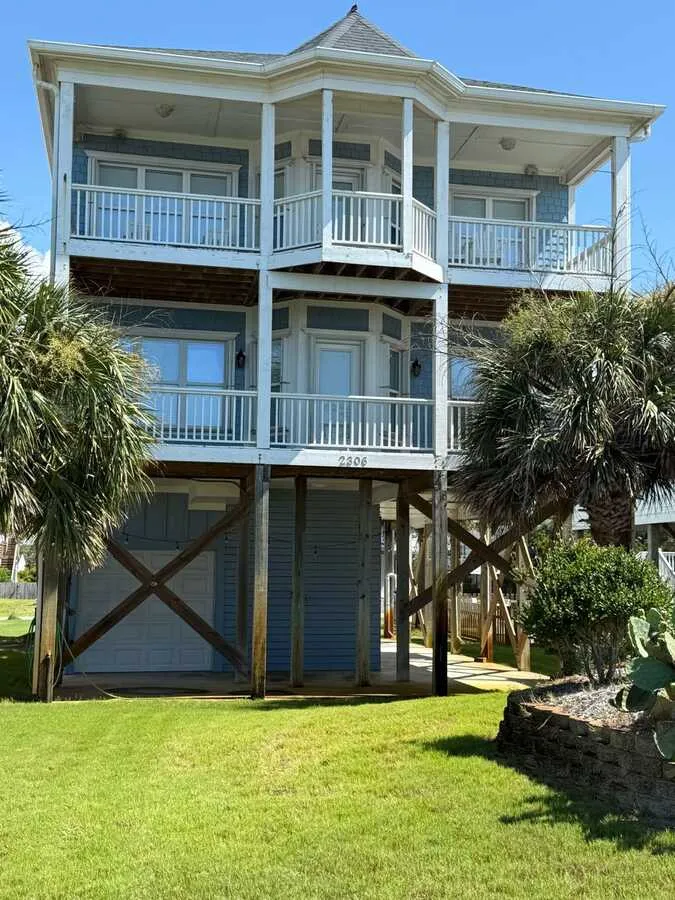 Three-story raised home with stacked porches