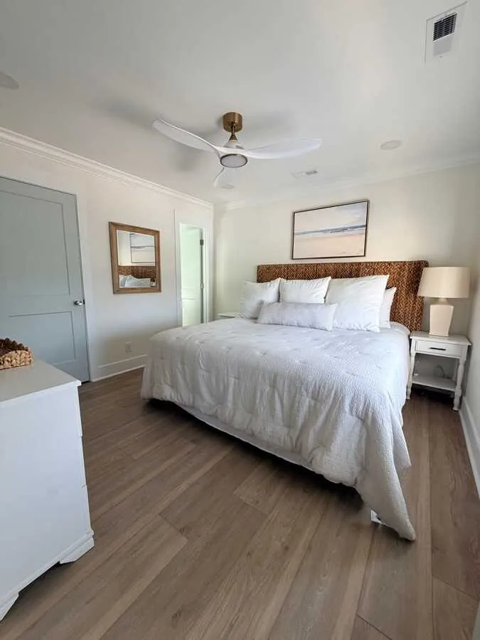 Renovated bedroom with ceiling fan