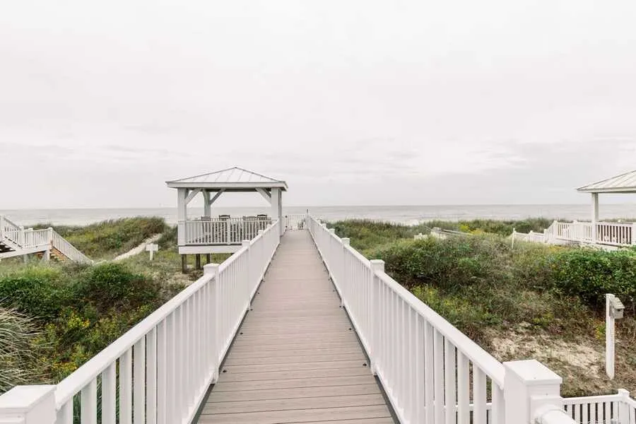 Long composite dune walkover leading to a white gazebo overlooking the ocean